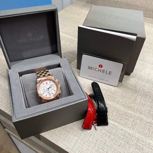 Rose gold Michele diamond watch with two bands. Lightly used needs new battery.